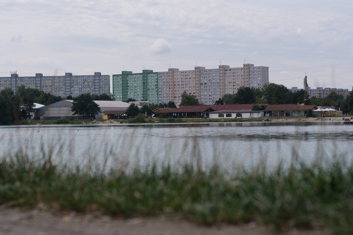 Housing blocks on the far shore of a lake